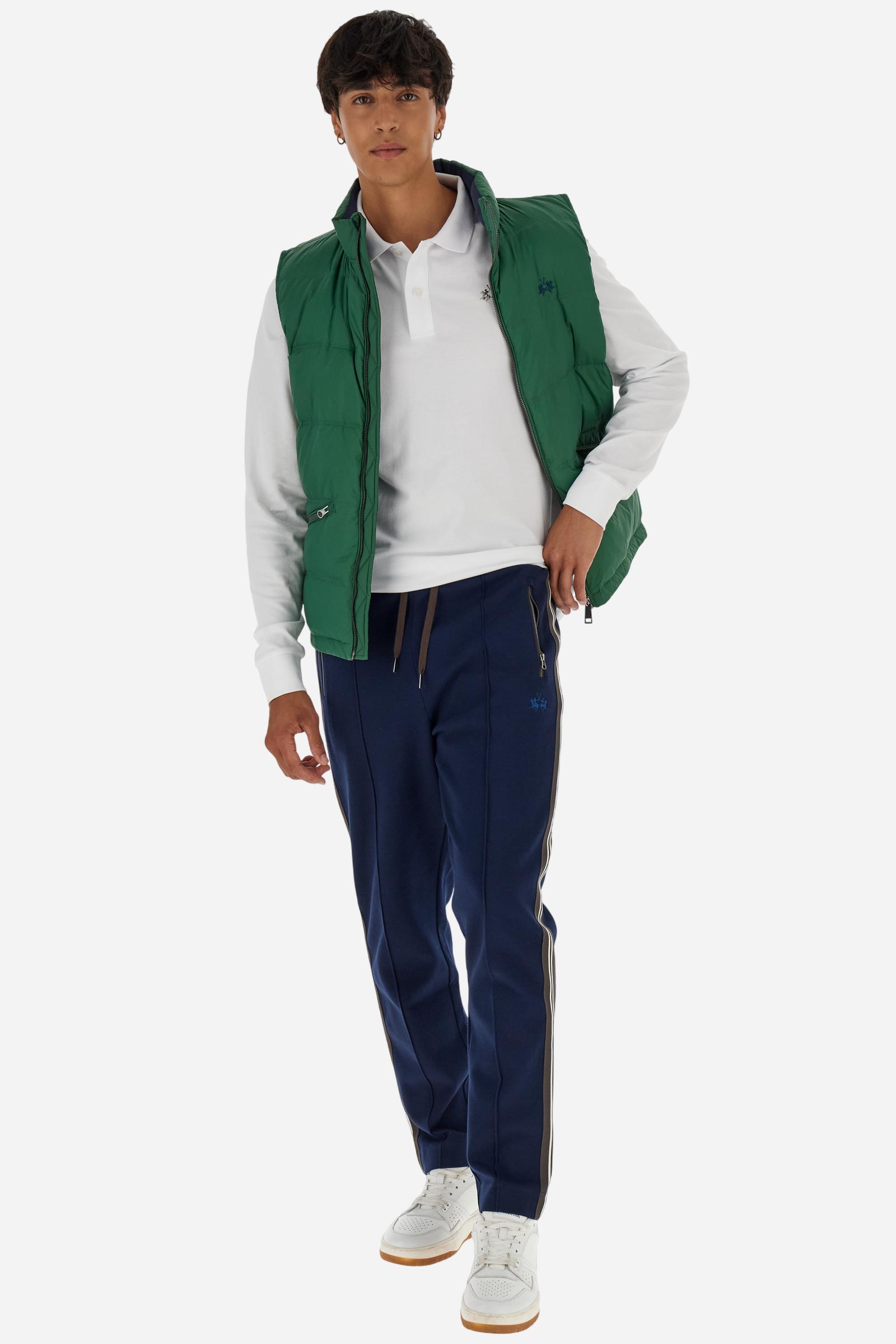 Men’s long-sleeve polo in high-quality stretch cotton piqué for comfort and flexibility. Tone-on-tone ribbed collar with contrast gabardine undercollar embroidered with the brand’s iconic lettering, revealed when the collar is lifted. Contrast embroidered logo on the chest. Slim fit, offering a modern silhouette that enhances the body while ensuring freedom of movement. Model wears size L. - Optic White