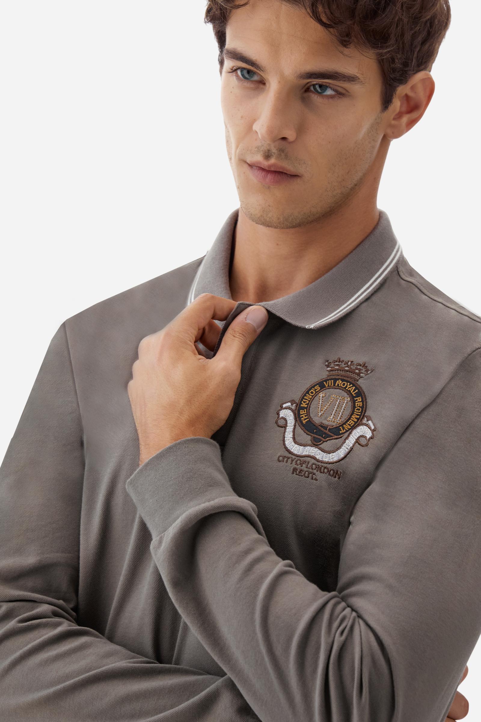 Long-sleeve polo shirt in stretch cotton jersey, soft and breathable. Ribbed collar with contrast striped edge and inner tartan ribbon. A colorful embroidered crest enriches the chest, complemented by a tonal embroidered logo under the placket with two personalized buttons. Regular fit for a versatile, timeless look. Model wears size L. - Falcon