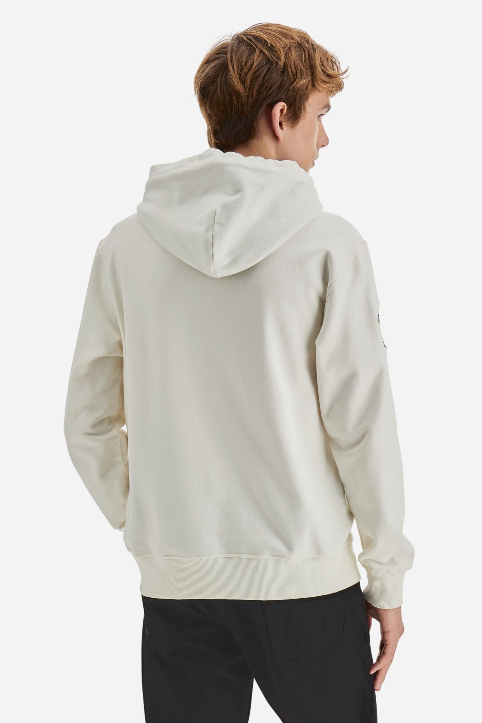 Men's long-sleeved hoodie in solid cotton French terry. Features a large kangaroo pocket, hem and cuffs in tone-on-tone rib. Adjustable hood with contrast lining. Chest and sleeves decorated with modern LM monogram graphics inspired by British polo. Contrasting embroidered logo on the chest. Regular fit for a relaxed and comfortable silhouette. Model wears size L. - Off White