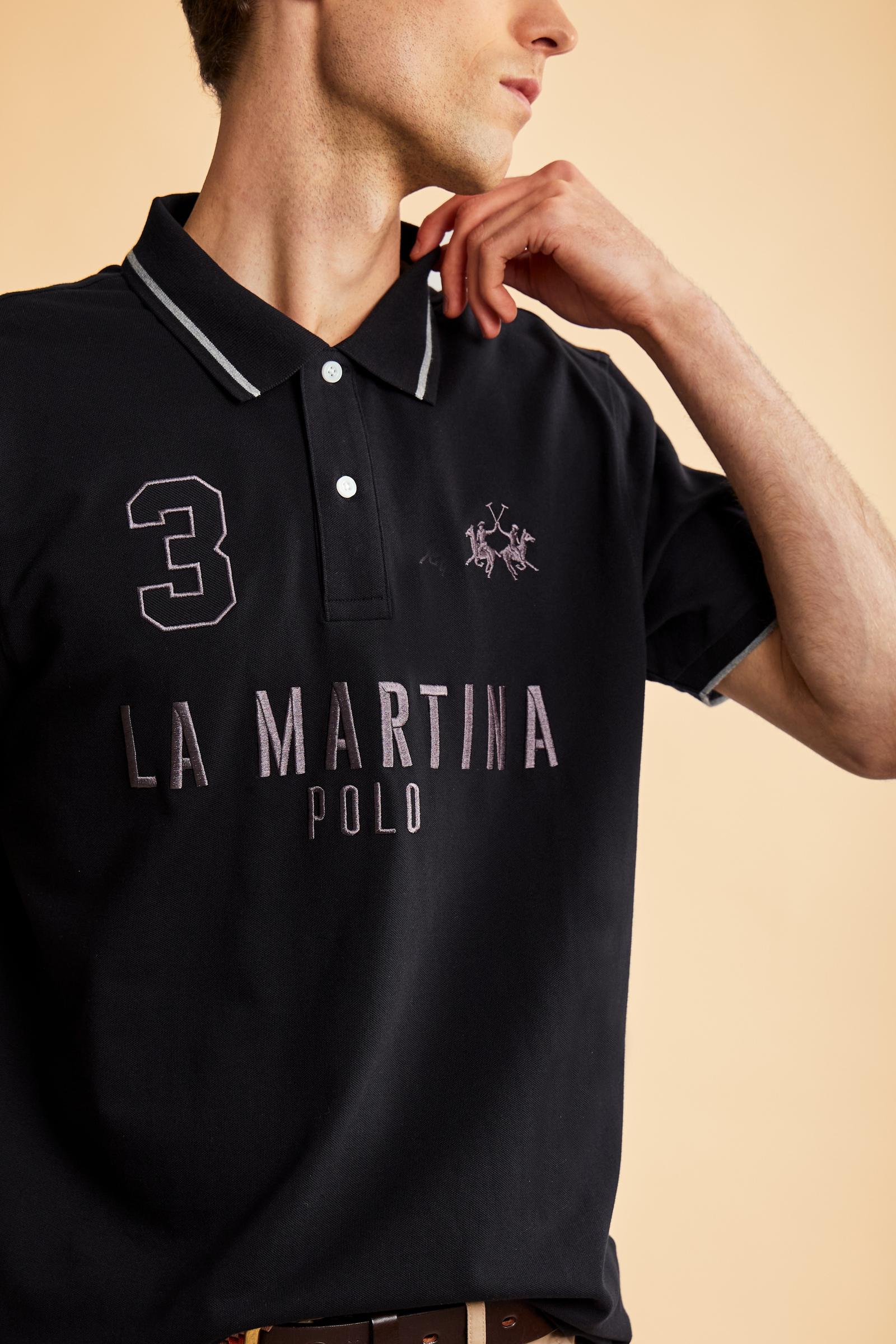 Men's short-sleeve polo in stretch piqué fabric with ribbed details, embroidered logo, bold lettering, and a relaxed regular fit for versatile comfort. - Black