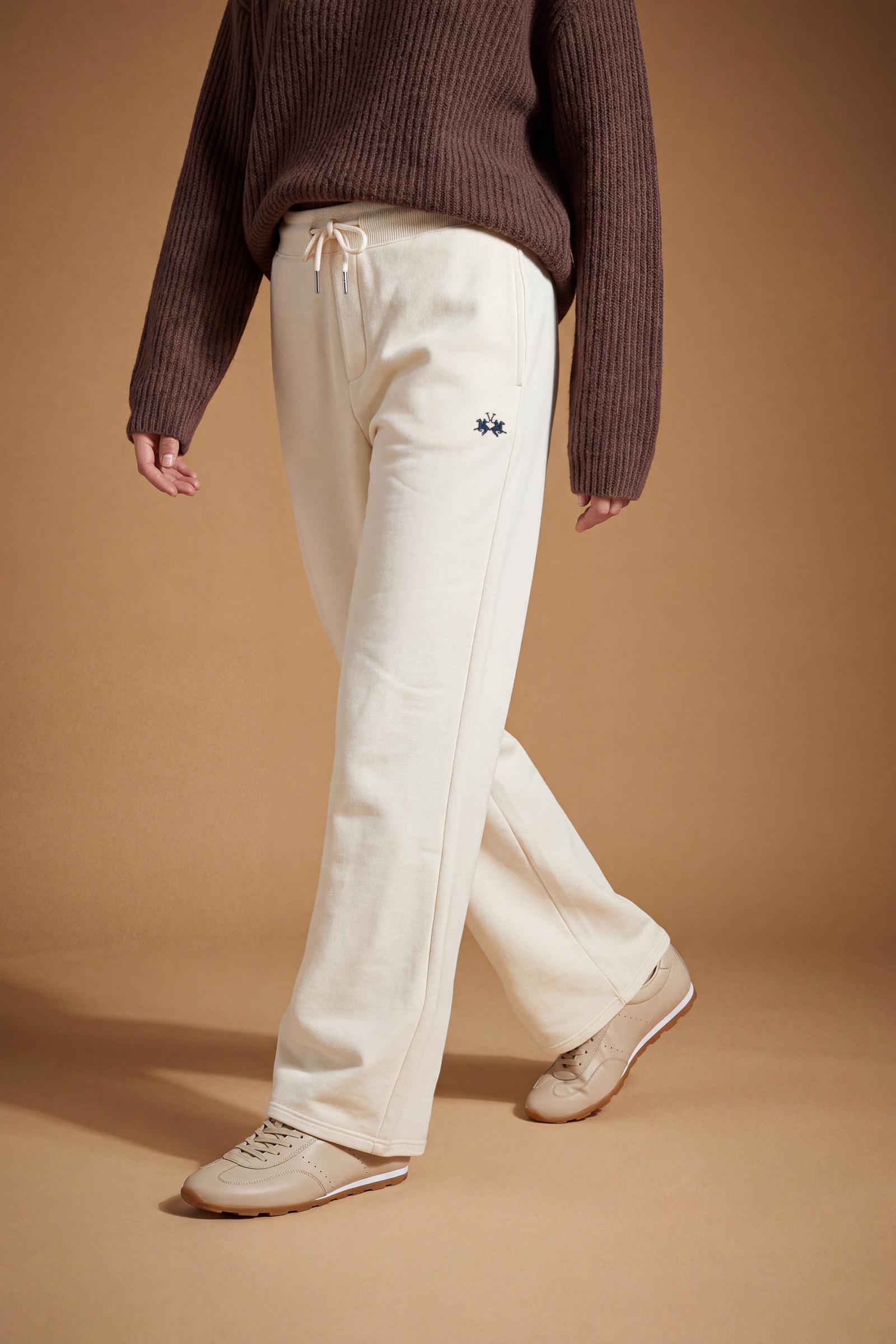 Women's pants in soft brushed cotton with an elastic waistband, adjustable drawstring, vertical side pockets, and a relaxed wide-leg fit for all-day comfort. - Pristine