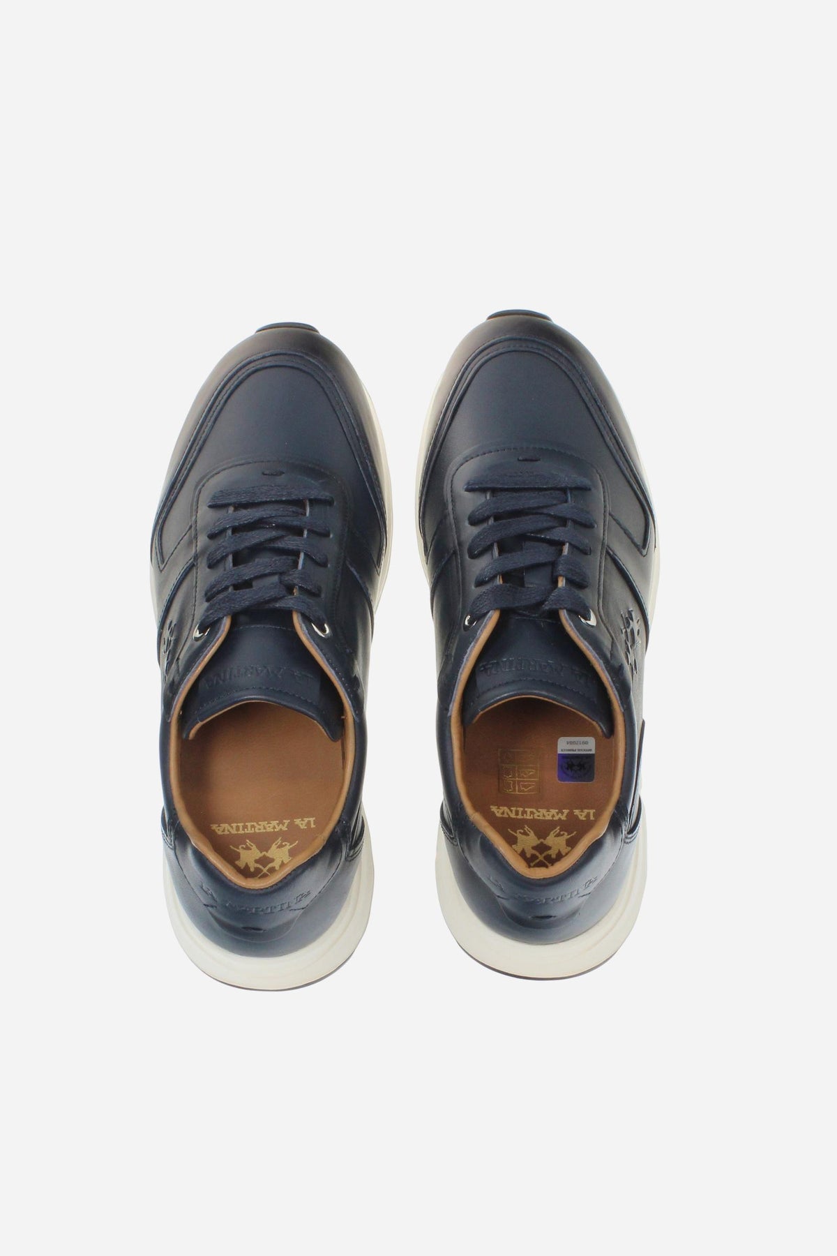 Men's leather sneaker with tone-on-tone stitching, hand-stitched details, embossed logos, and a lightweight two-tone EVA sole for comfort and grip. - Salute