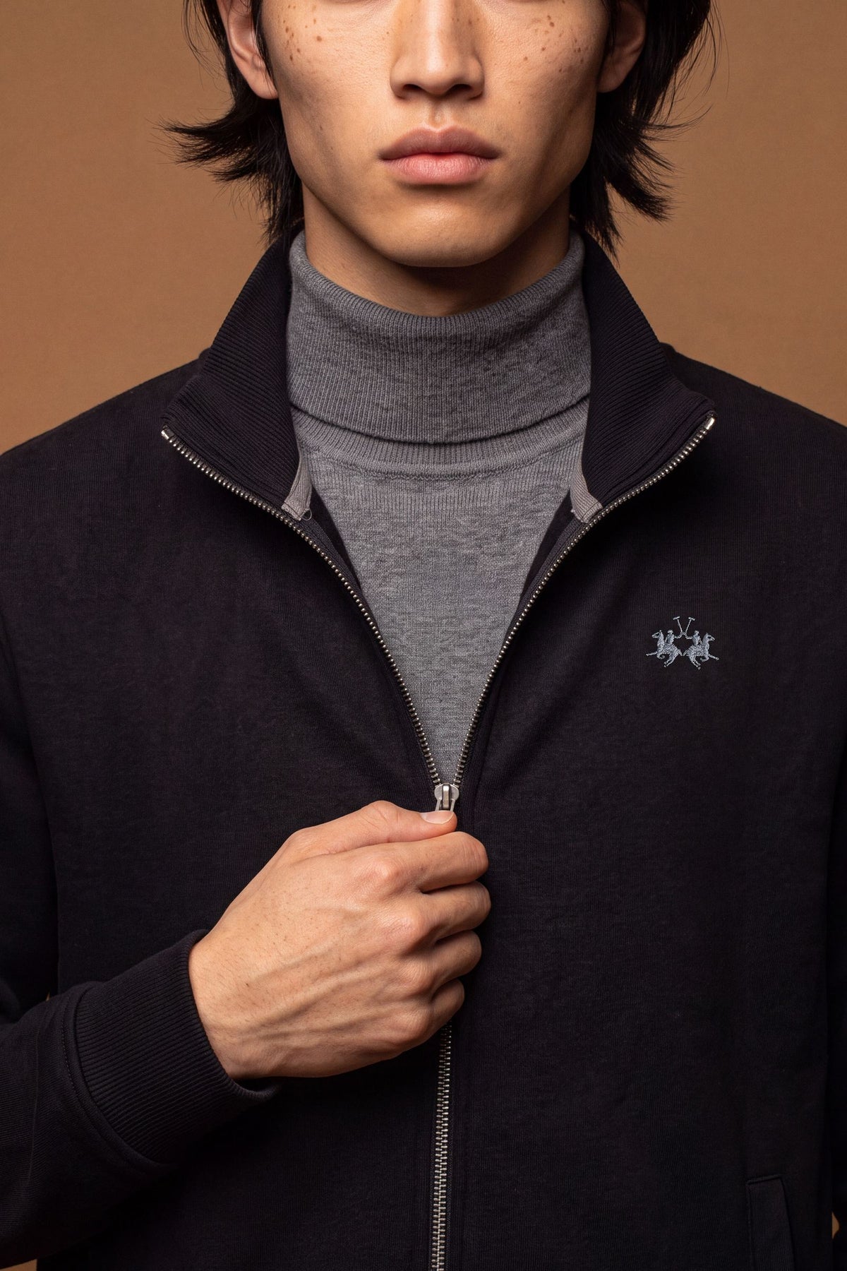 Men's 100% cotton fleece sweatshirt with a high collar, customized zipper, ribbed cuffs and hem, regular fit, and a subtle embroidered logo for comfort and style. - Black