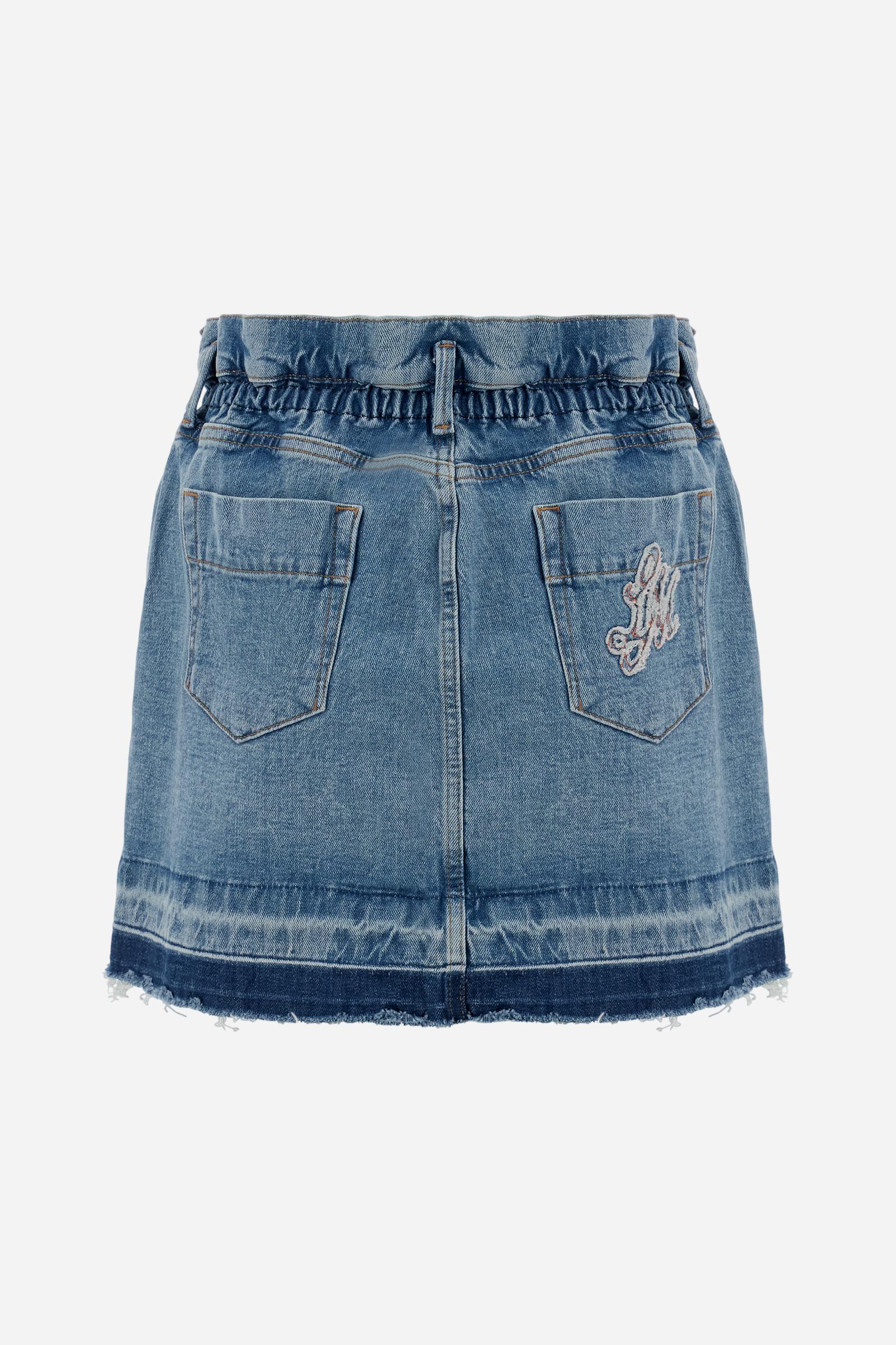 Denim mini skirt with light-medium wash and worn-in effect. Slightly flared five-pocket style with raw-cut hem and contrast pocket with logo. - Medium Indigo Denim