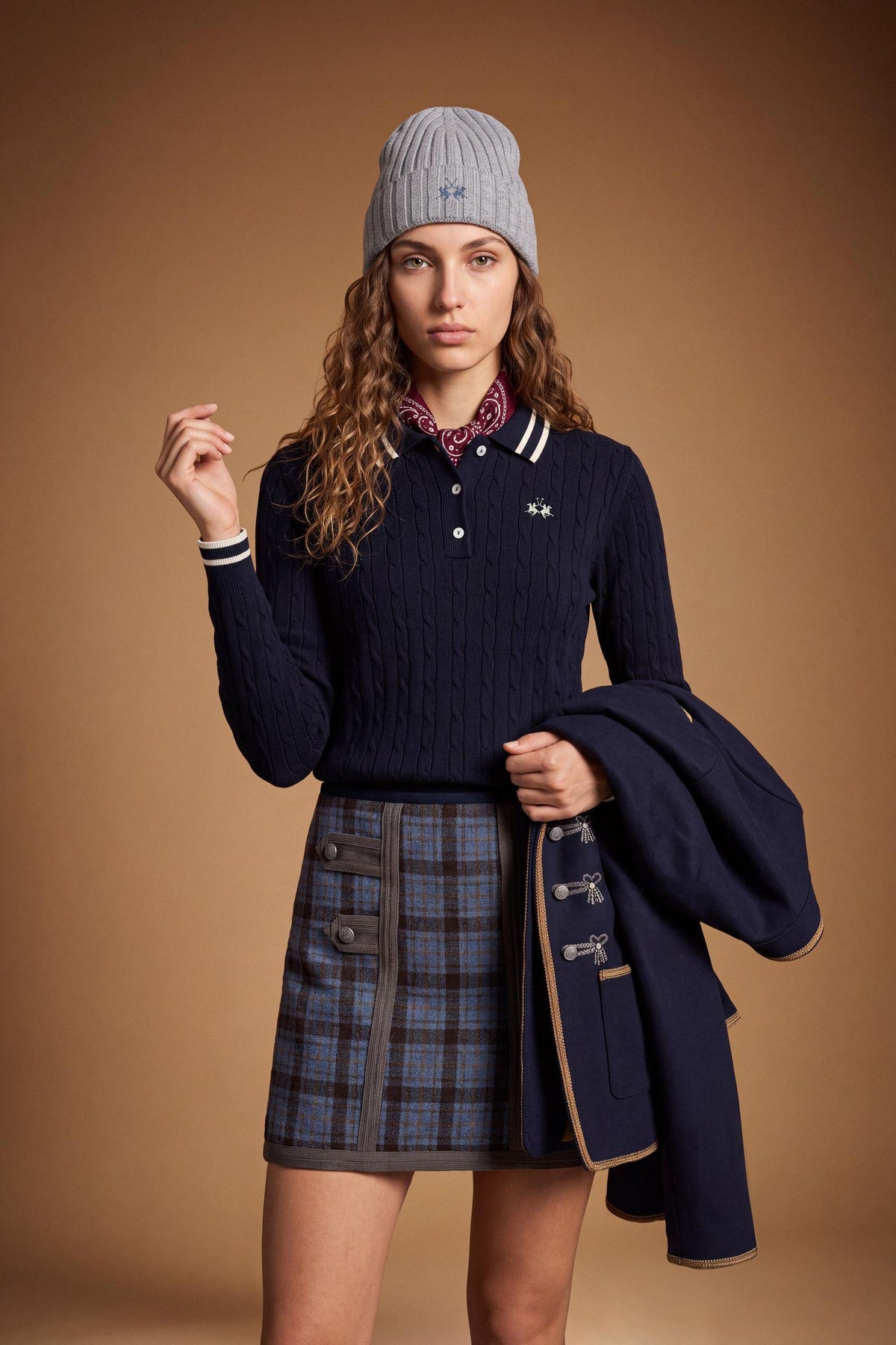 Women's long-sleeve polo in soft lambswool blend, featuring a vertical cable knit, contrast-edged collar, ribbed cuffs, and a slim, comfortable fit. - Navy