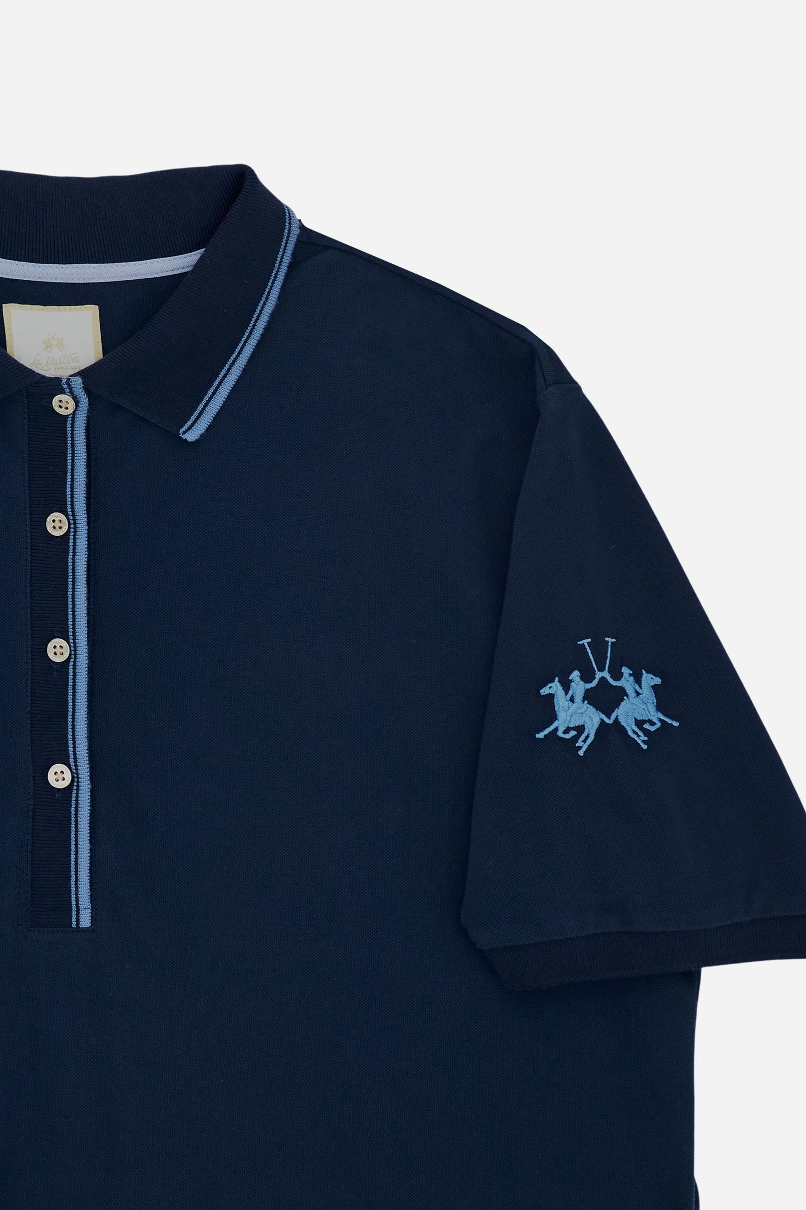 Women’s short-sleeve polo dress crafted in 30/1 pure cotton piqué, soft to the touch with a refined, slightly silky appearance. The comfort fit silhouette flows naturally along the body, while the above-the-knee length defines a contemporary style. The deep placket is enhanced with custom gold buttons, and the two-tone ribbed collar and cuffs add a distinctive touch. Contrast embroidered logo on the left sleeve. The model wears size 2. - Navy                                                                  