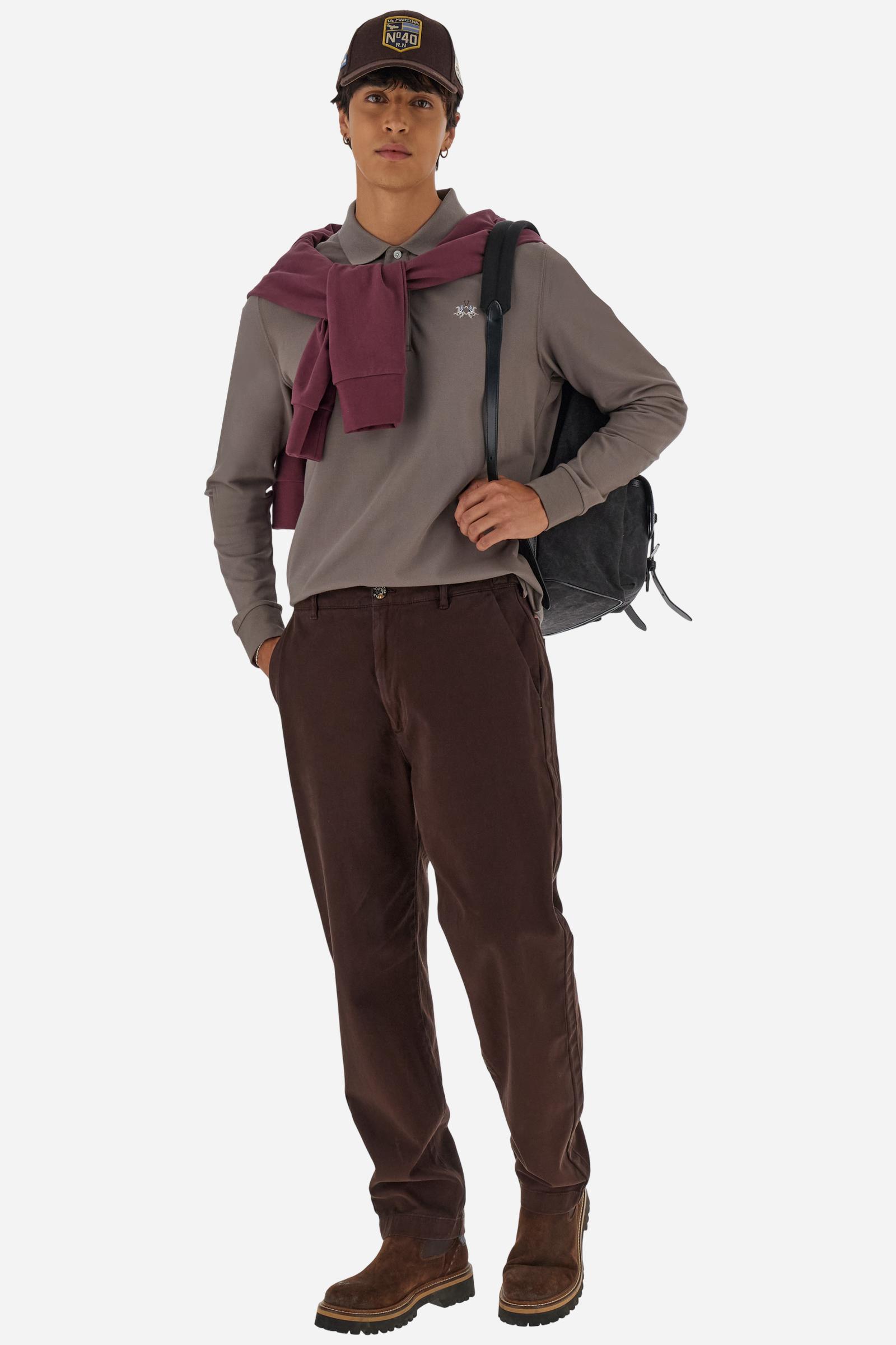 Men’s long-sleeve polo in high-quality stretch cotton piqué for comfort and flexibility. Tone-on-tone ribbed collar with contrast gabardine undercollar embroidered with the brand’s iconic lettering, revealed when the collar is lifted. Contrast embroidered logo on the chest. Slim fit, offering a modern silhouette that enhances the body while ensuring freedom of movement. Model wears size L. - Falcon