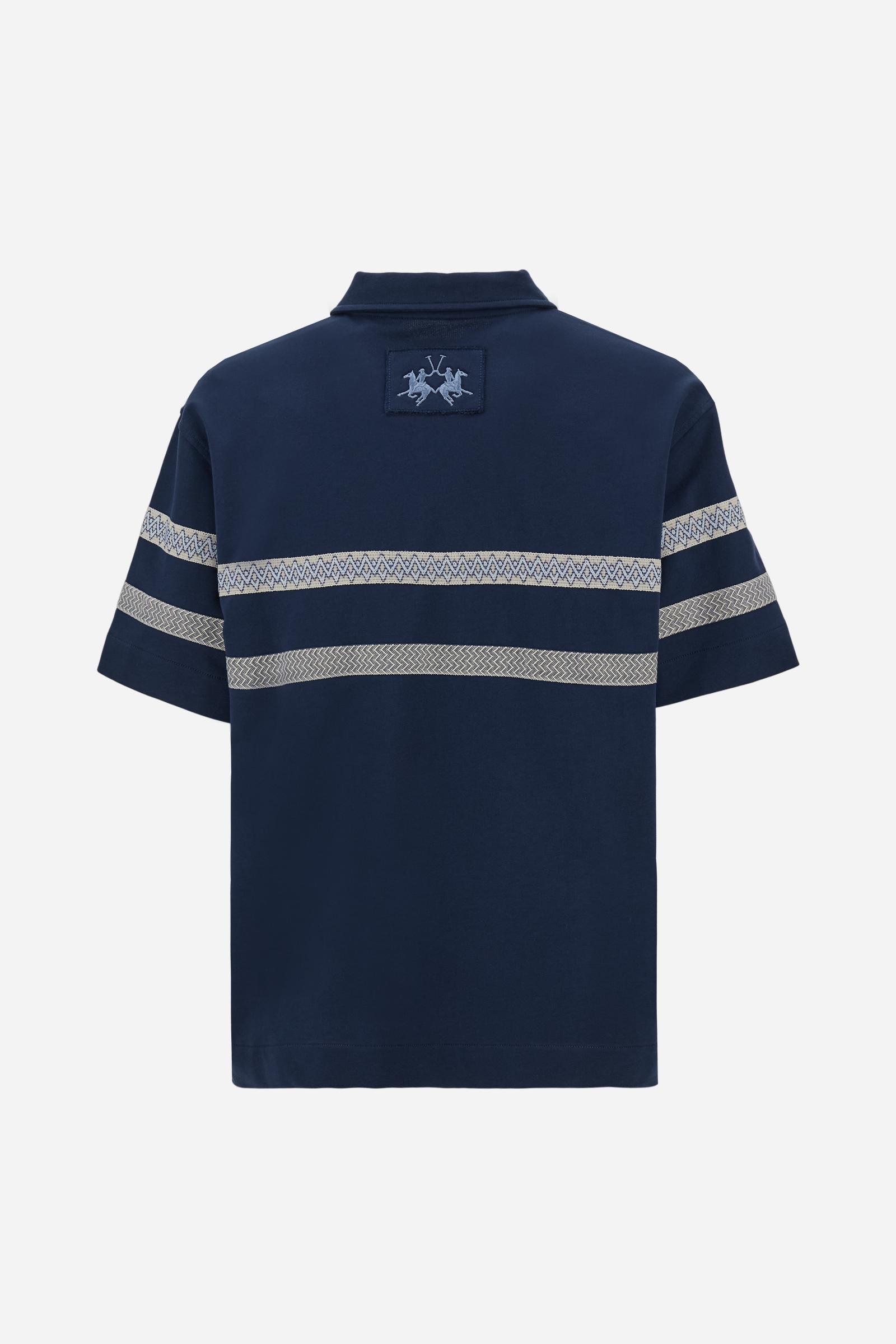 Short-sleeve polo in heavy cotton jersey with a compact structure and substantial hand feel. Contemporary fit with relaxed volume and slightly dropped shoulders. Classic collar with visible placket and bold horizontal band with geometric multicolor tapes. Raised “La Martina” embroidery on the chest and contrasting 3D logo on the back. - Navy                                                                                                                                                                         