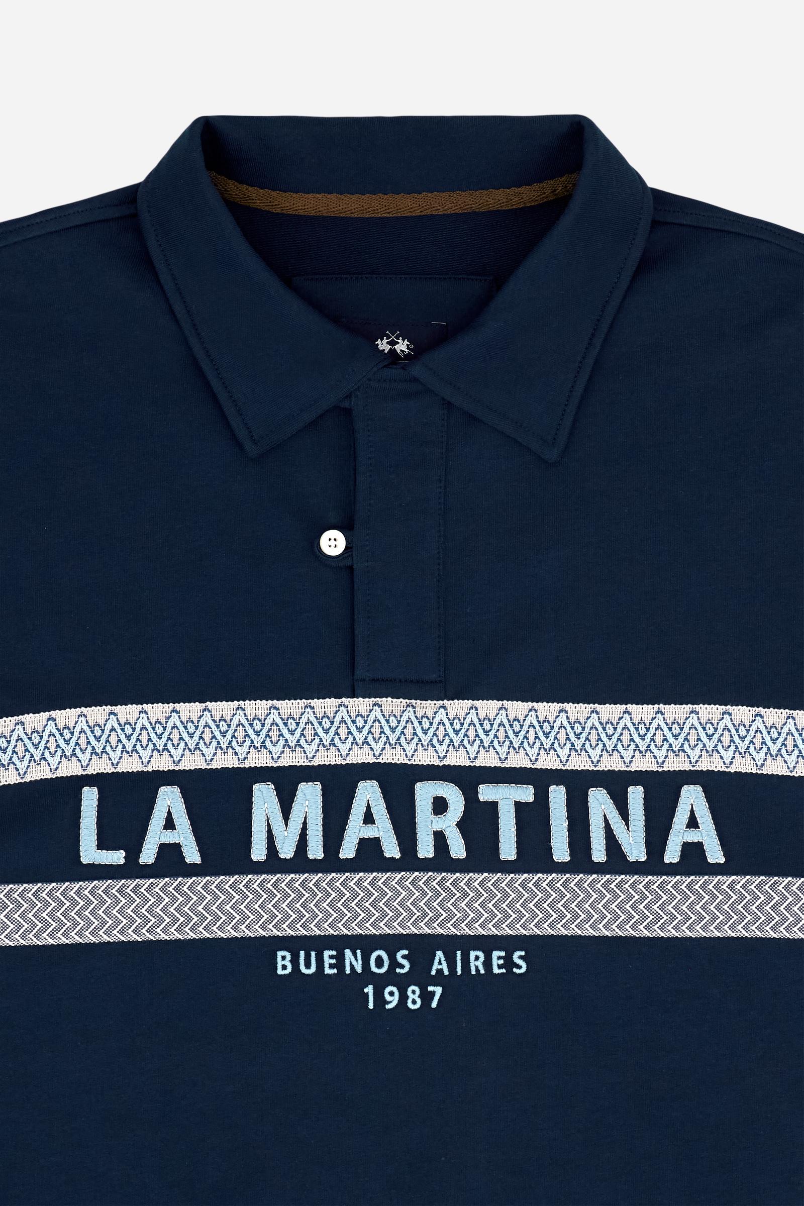 Short-sleeve polo in heavy cotton jersey with a compact structure and substantial hand feel. Contemporary fit with relaxed volume and slightly dropped shoulders. Classic collar with visible placket and bold horizontal band with geometric multicolor tapes. Raised “La Martina” embroidery on the chest and contrasting 3D logo on the back. - Navy                                                                                                                                                                         