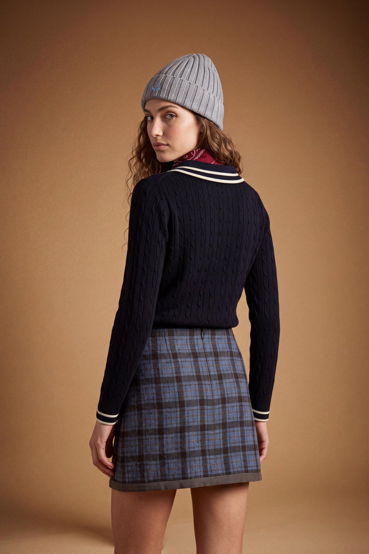 Women's long-sleeve polo in soft lambswool blend, featuring a vertical cable knit, contrast-edged collar, ribbed cuffs, and a slim, comfortable fit. - Navy