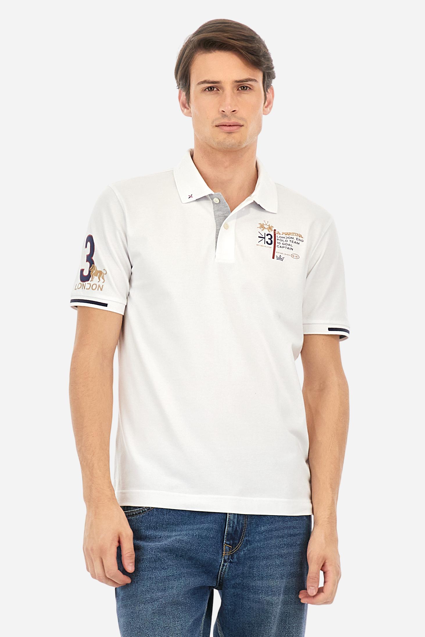 Short-sleeved, single-colour men's polo shirt made of stretch cotton piqué. Fastens with two buttons and internal opening, button side, in contrasting fabric. Ribbed collar and cuffs. The cuffs feature an inlaid detail in a contrasting colour. The graphics on the chest and back are made with mixed techniques: printing and embroidery. The logo is embroidered on the chest, left side. The fit is regular. The model is wearing a size L. - Optic White
