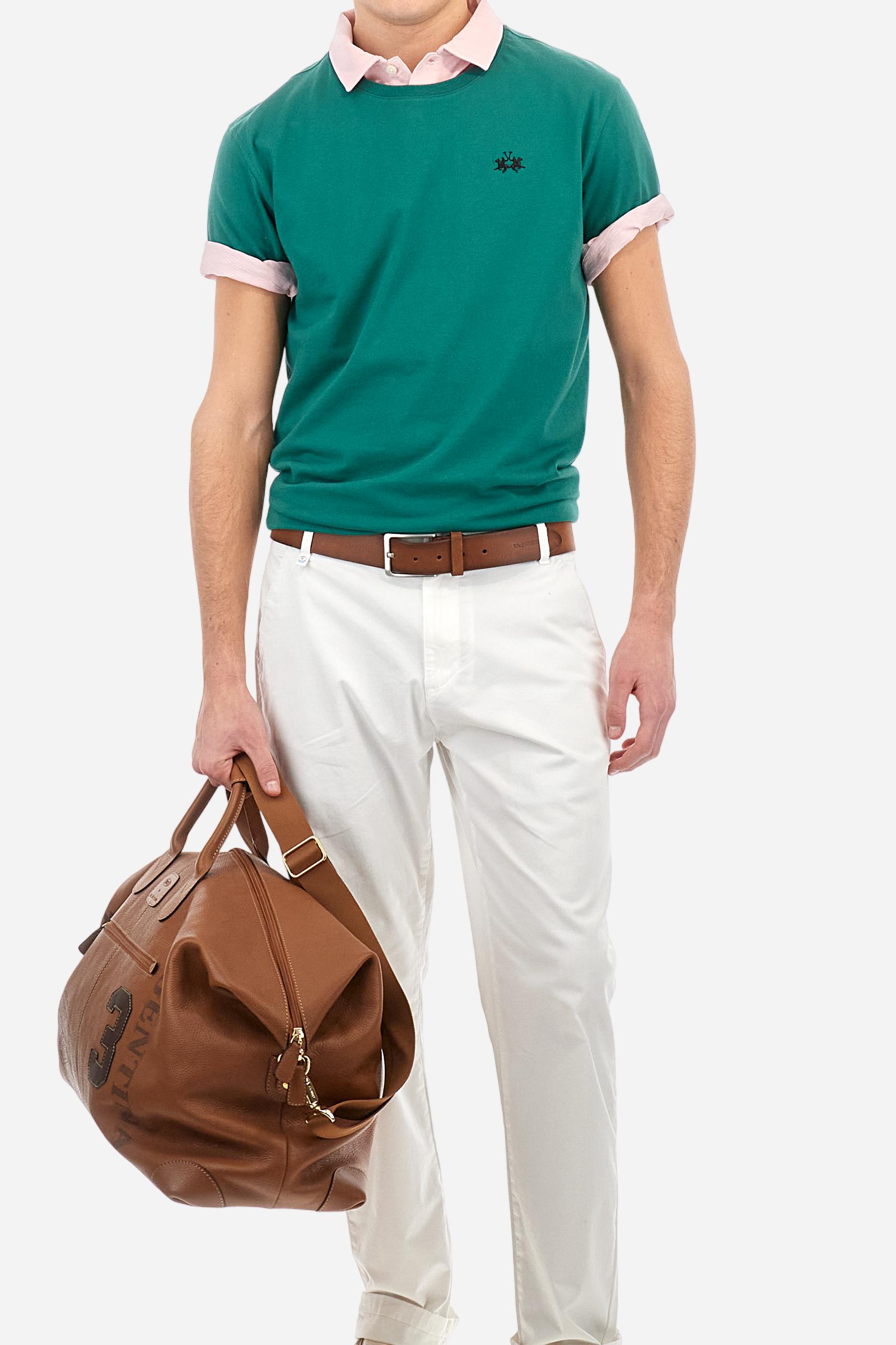 Men's short-sleeved crew-neck T-shirt in solid colour with embroidered logo in contrasting colour on the chest. Made of 100% cotton with a regular fit. It is perfect paired with Bermuda shorts or trousers for a casual and trendy look. Suitable for leisure time. The model is 187 cm tall and wears a size L. - Evergreen