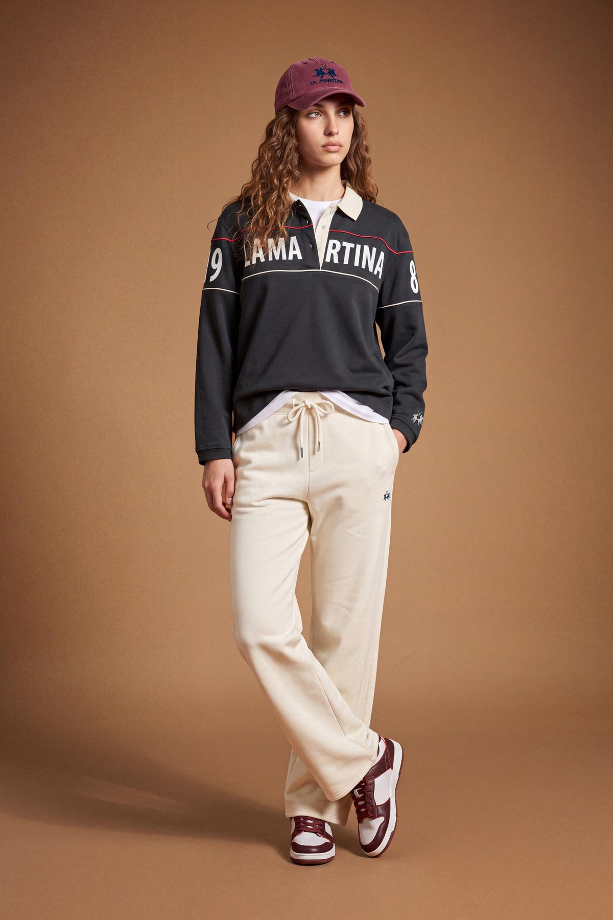 Women's long-sleeve polo made from heavyweight 100% cotton jersey, featuring a comfortable fit, contrasting collar, piping detail, printed band, and embroidered logo cuff. - Navy Blazer