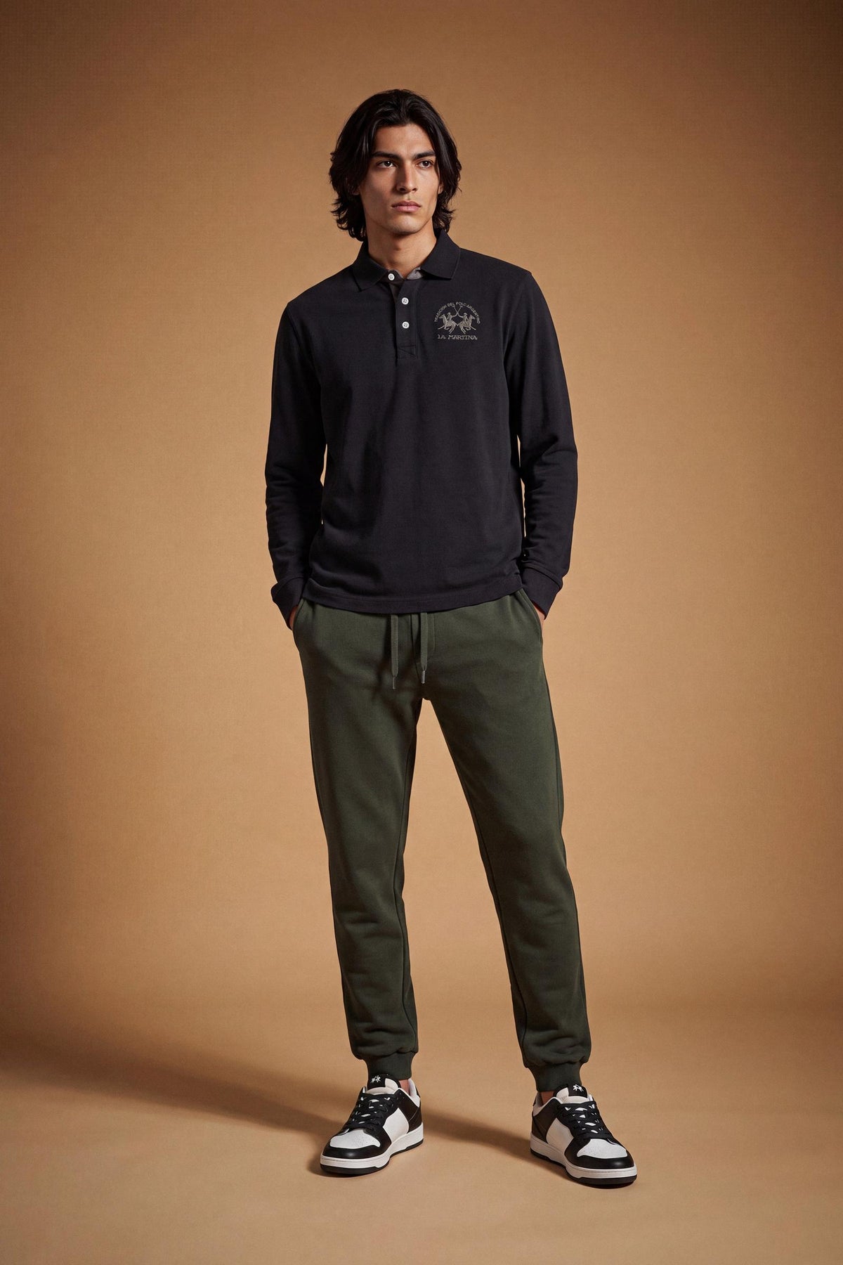Men's long-sleeve polo in soft cotton jersey with contrasting gabardine collar, ribbed details, multicolor striped placket, and embroidered team logo for comfor - Black