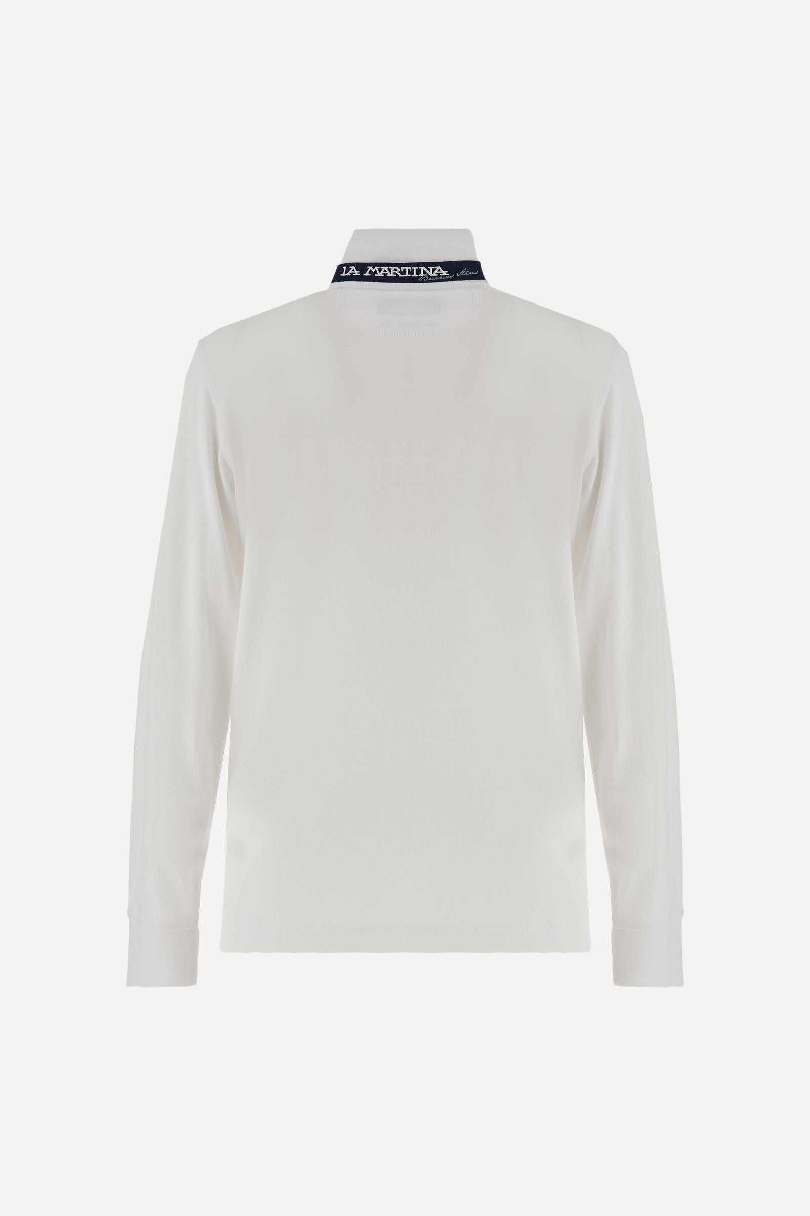 Men’s long-sleeve polo in high-quality stretch cotton piqué for comfort and flexibility. Tone-on-tone ribbed collar with contrast gabardine undercollar embroidered with the brand’s iconic lettering, revealed when the collar is lifted. Contrast embroidered logo on the chest. Slim fit, offering a modern silhouette that enhances the body while ensuring freedom of movement. Model wears size L. - Optic White