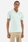 Men's single-colour short-sleeved polo in elasticated cotton. Two-button fastening. Tone-on-tone stitching. Ribbed collar and armholes. The "La Martina" lettering can be found under the collar. Featuring a small logo embroidered on the chest. In a slim fit. The model wears a size L. - Honeydew