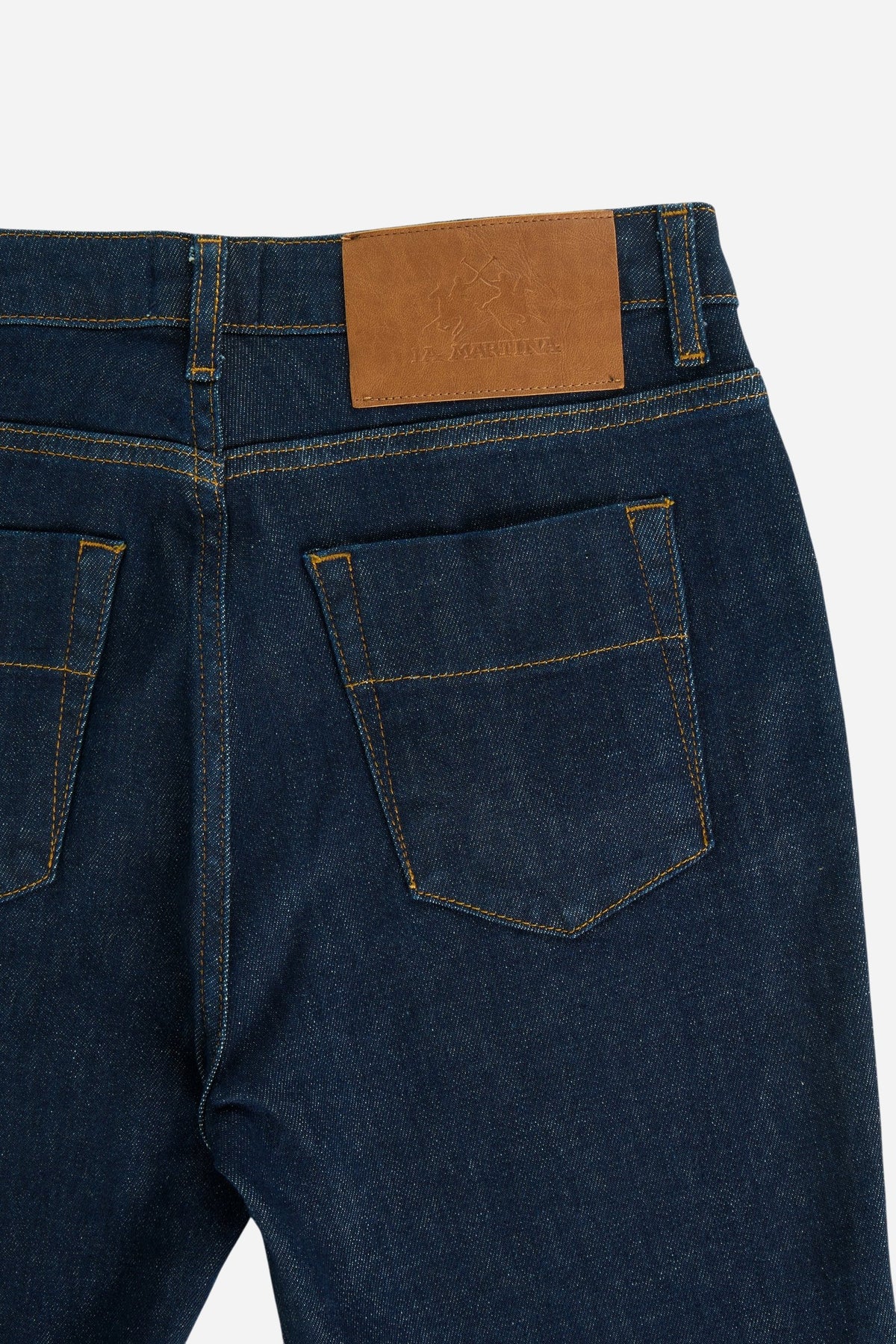 Women’s five-pocket denim trousers. Regular-fit style with straight leg, medium blue wash with stone-wash treatment and personalised leather patch. - EXTRA DARK DENIM