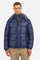 Men's single-colour quilted bomber jacket with hood and zip fastening, made of synthetic fabric. Featuring two front pockets with zip closure. Removable hood. The logo can be found on a patch applied to one of the sleeves. Regular fit. The model is wearing a size L. - Navy