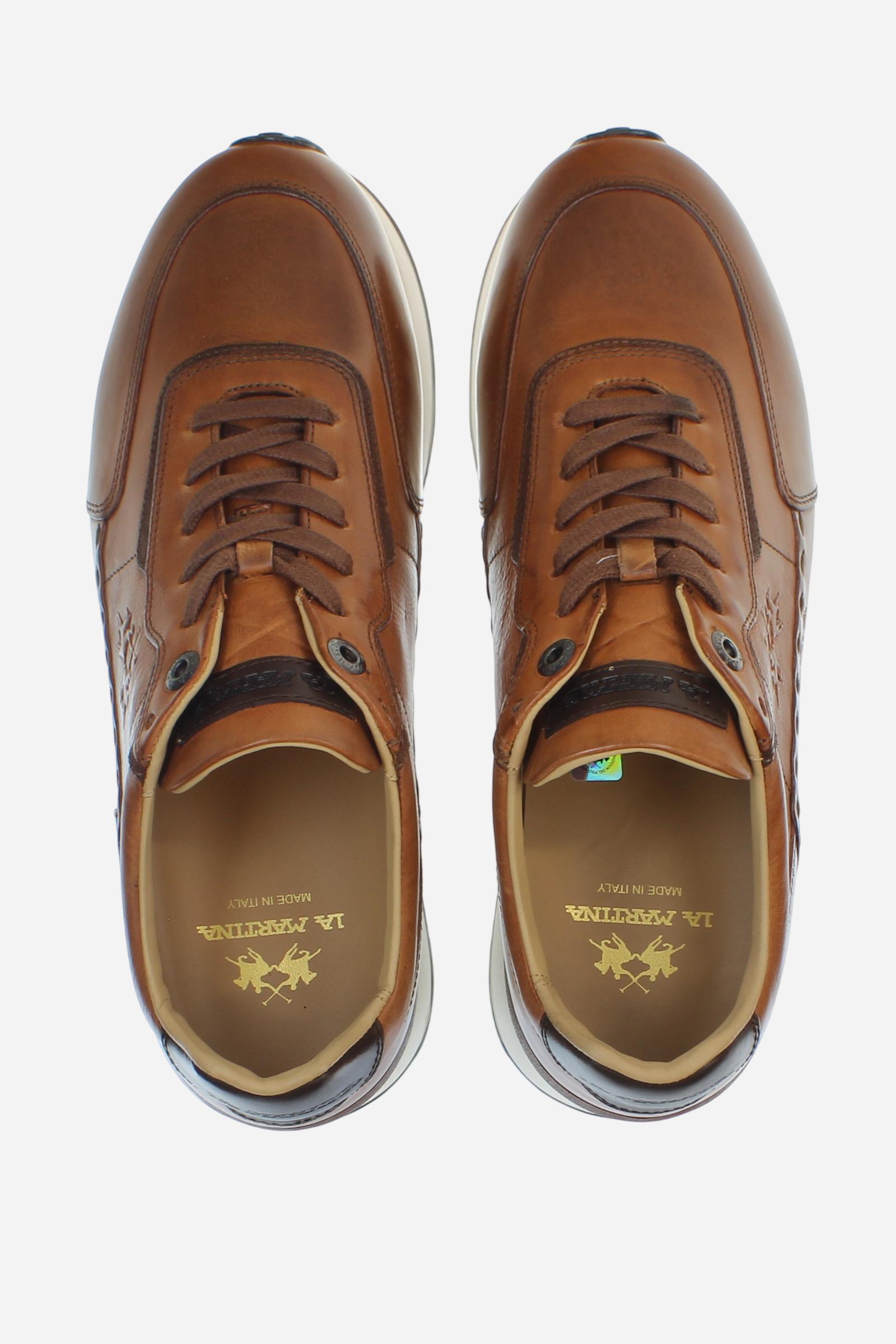 Sporty and elegant leather trainers with ultralight technical soles in XL Extralight EVA. Perfect for anyone in search of comfort, performance and handcrafted details. - COGNAC