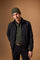 Men's padded jacket in cotton-polyamide blend for comfort and durability. Features high collar, zip closures, elastic ribbed trims, and polyester quilted lining - Black