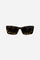 Women’s sunglasses crafted from acetate, available in a range of finishes that enhance the depth of color and the material’s natural shine. The dark nylon lenses, shaded upward, provide high UV protection and optimal visual comfort. The oversized rectangular silhouette recalls the iconic charm of the 1960s, reinterpreted through clean lines and contemporary proportions. Wide temples are embellished with the brand’s gold logo, a distinctive detail that completes the design with elegance. - CocoaBrown/AmberGo
