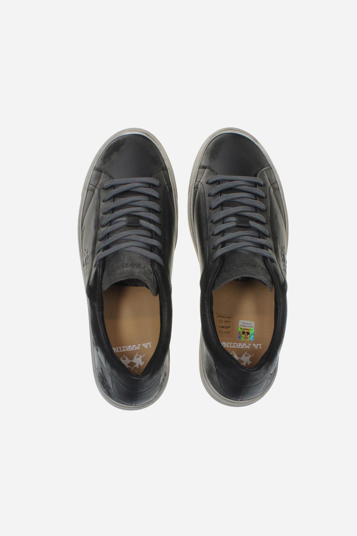 Leather sneaker blending vintage and modern style, with flexible divided tongue, nubuck heel, hand-stitched details, and a lightweight, comfortable off-white sole. - Black