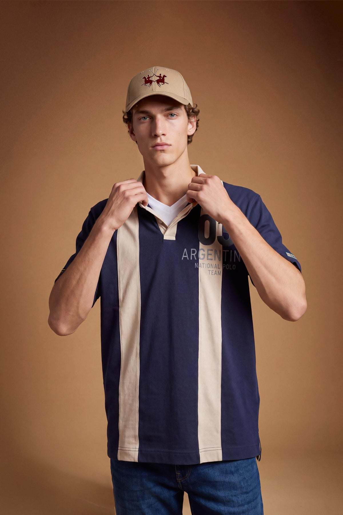 Men's short-sleeve polo in heavy 100% cotton with wide contrasting stripes, knitted collar, two-button placket, relaxed fit, and bold chest embroidery. - Navy Blazer