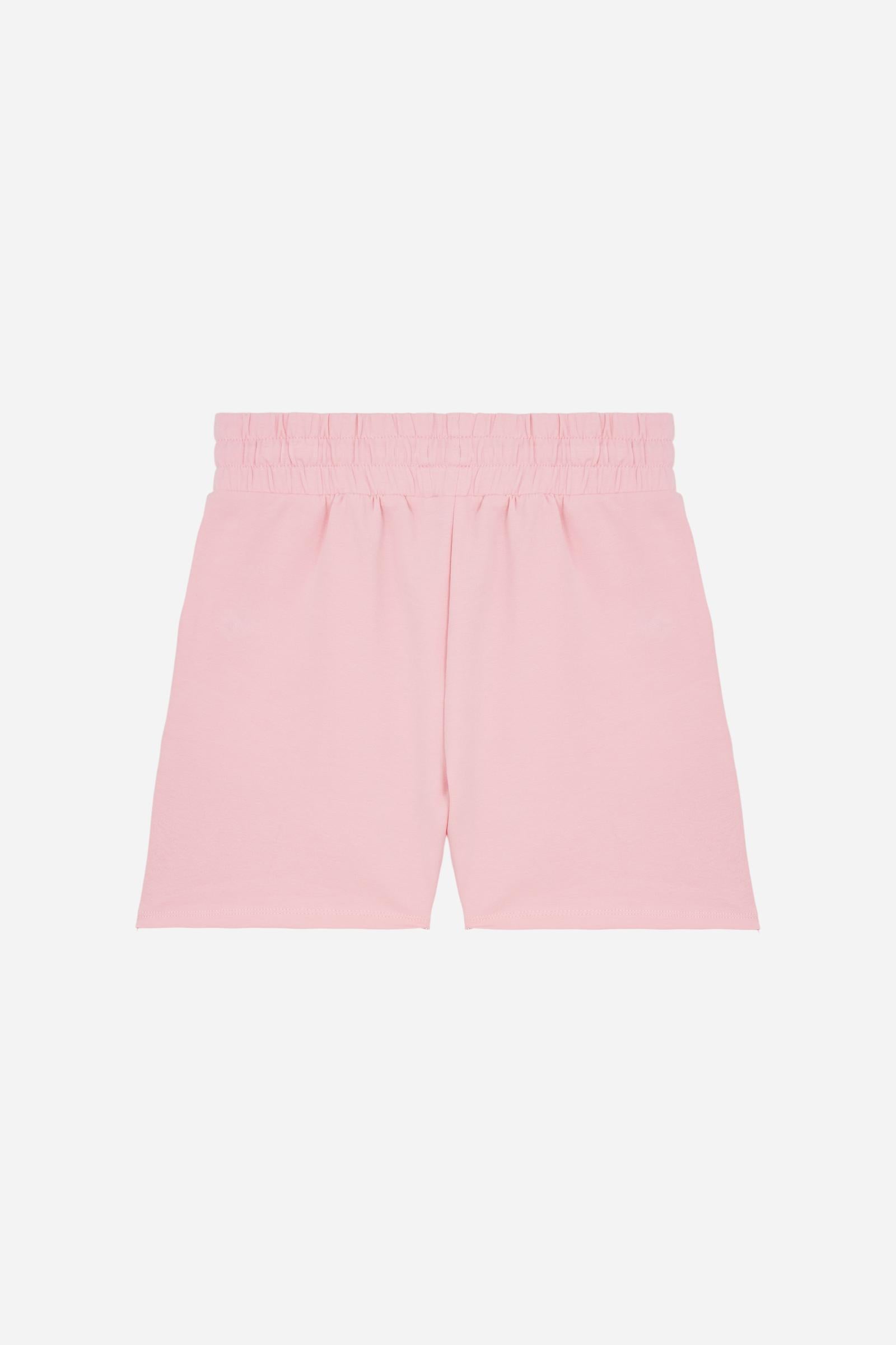 Bermuda shorts for girls made from soft 100% cotton fleece in a solid colour. The style features a regular fit, short leg and elasticated waist with adjustable drawstring. The small contrast embroidered brand logo on the left leg adds a discreet and distinctive detail. A comfortable, versatile garment, ideal for casual and sporty looks. - FairTale