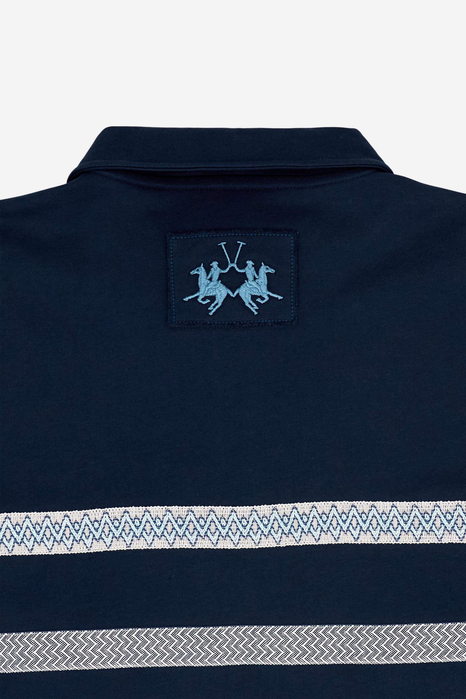 Short-sleeve polo in heavy cotton jersey with a compact structure and substantial hand feel. Contemporary fit with relaxed volume and slightly dropped shoulders. Classic collar with visible placket and bold horizontal band with geometric multicolor tapes. Raised “La Martina” embroidery on the chest and contrasting 3D logo on the back. - Navy                                                                                                                                                                         
