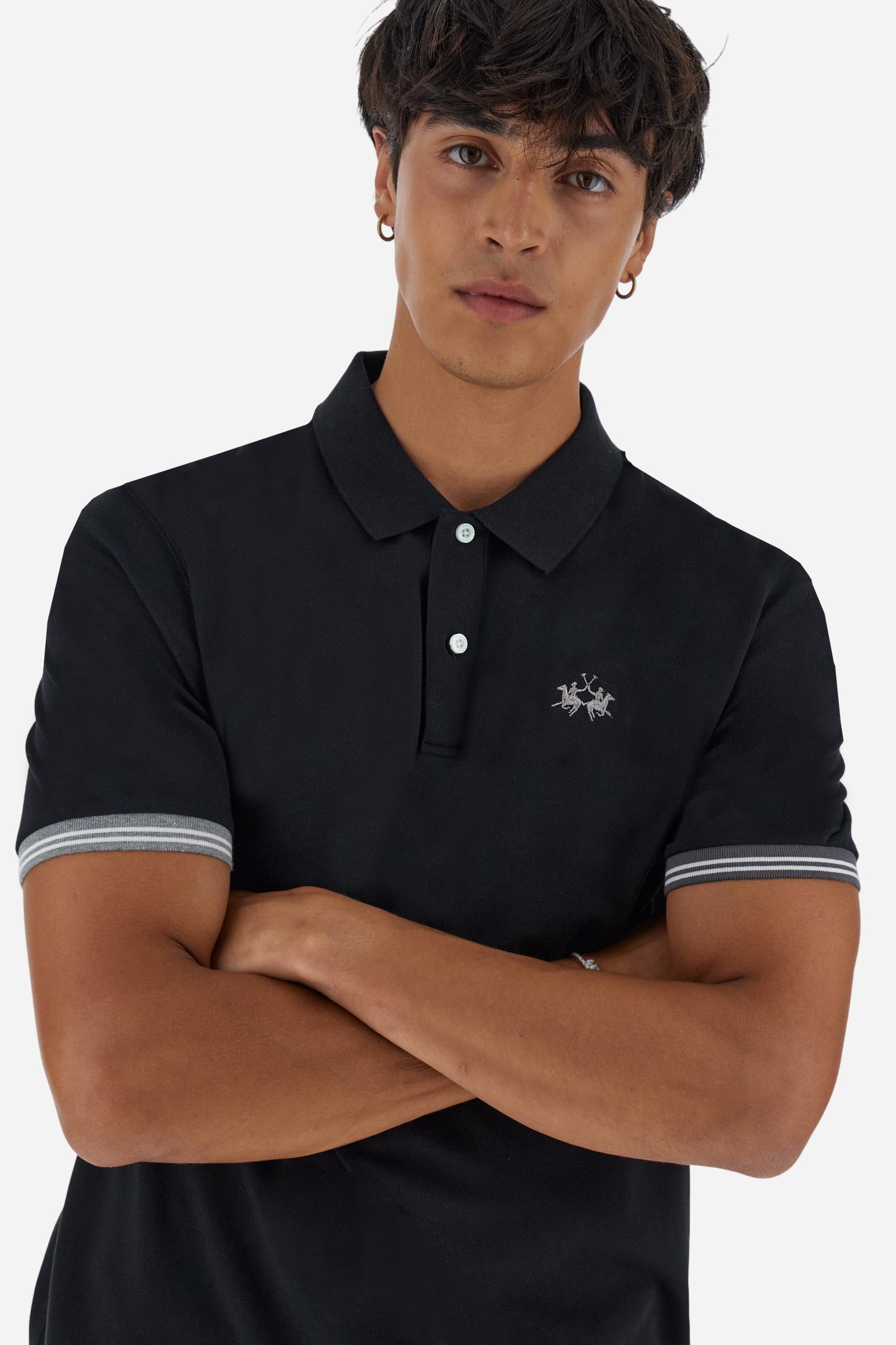 Men’s short-sleeve polo in high-quality stretch cotton piqué, ensuring excellent breathability and flexibility. Classic ribbed collar, two-button placket with customized buttons. Inner collar enriched with contrast tapes and colors for a modern touch. Multicolored ribbed cuffs with different patterns. Small contrast logo embroidered on the chest. Regular fit. Model wears size L. - Black