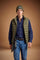 Men's sleeveless down jacket in lightweight nylon with wadding padding for warmth, zippered pockets, high collar, and contrasting interior and logo details. - Burnt Olive