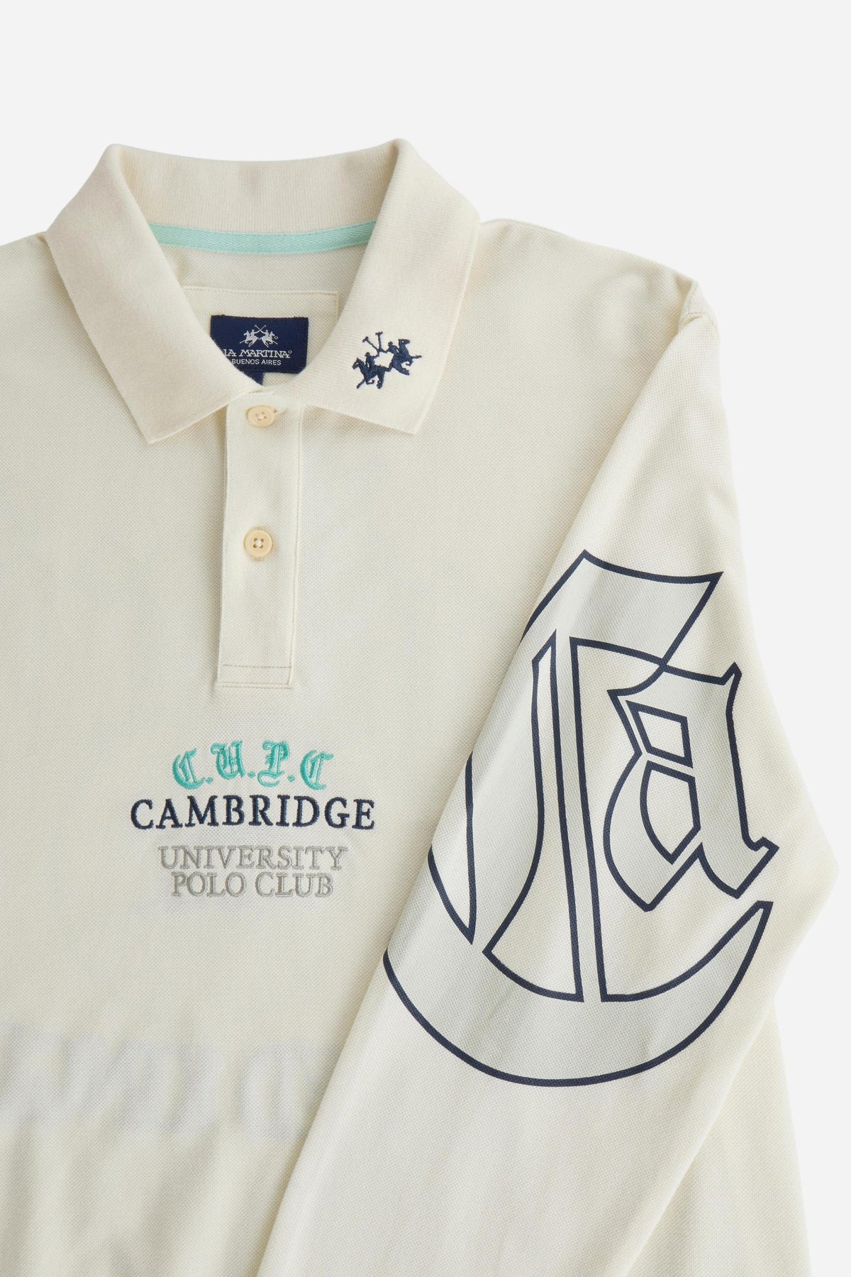 Men's long-sleeve cotton piqué polo with ribbed collar and cuffs, embroidered logo, outlined back print, and a relaxed regular fit for comfort and style. - Pristine
