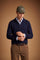 Men's knitted polo in cotton-wool blend with regular fit, ribbed cuffs and hem, classic collar, 2-button front, and subtle embroidered chest logo. - Navy