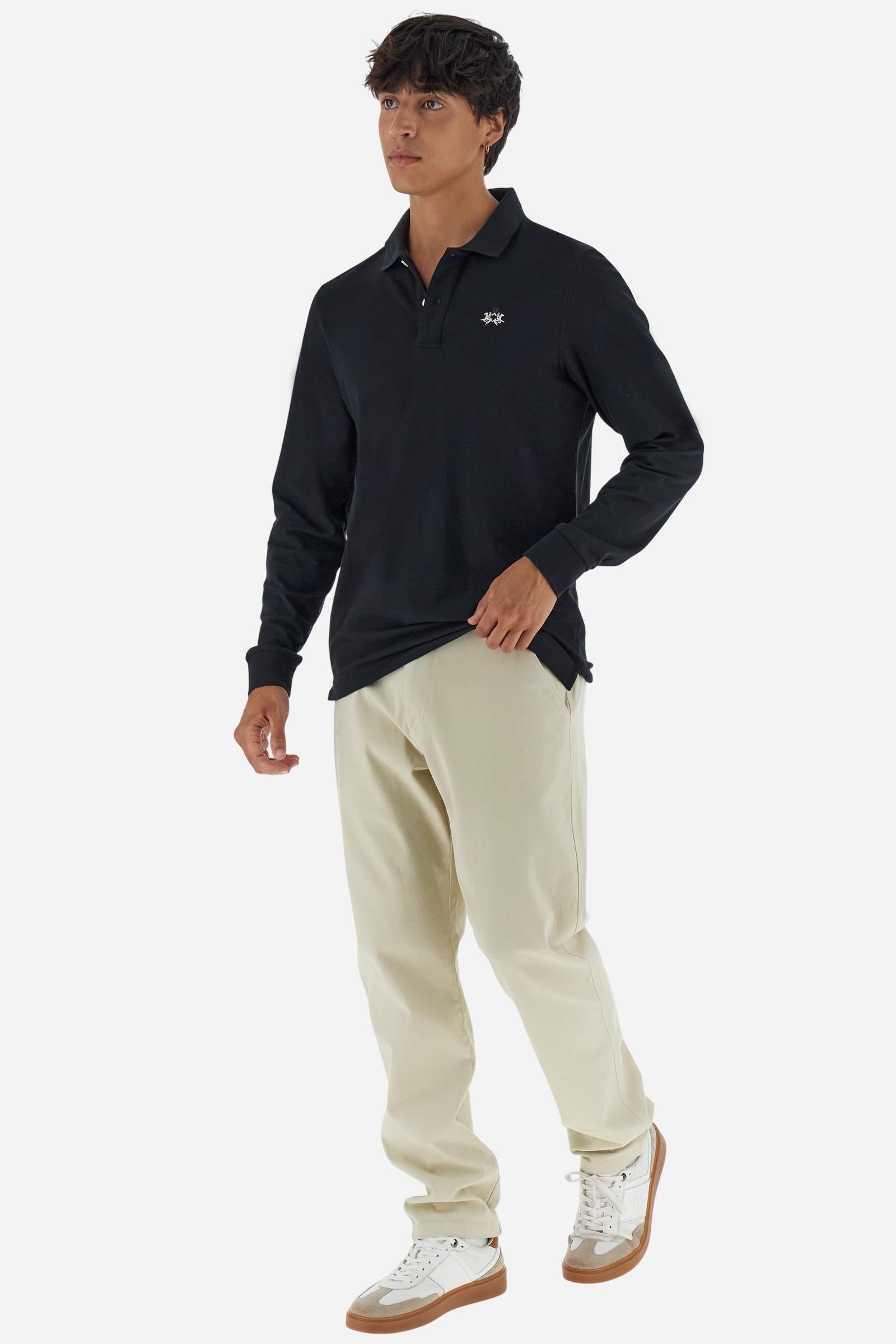 Men’s long-sleeve polo in high-quality stretch cotton piqué for comfort and flexibility. Tone-on-tone ribbed collar with contrast gabardine undercollar embroidered with the brand’s iconic lettering, revealed when the collar is lifted. Contrast embroidered logo on the chest. Slim fit, offering a modern silhouette that enhances the body while ensuring freedom of movement. Model wears size L. - Black