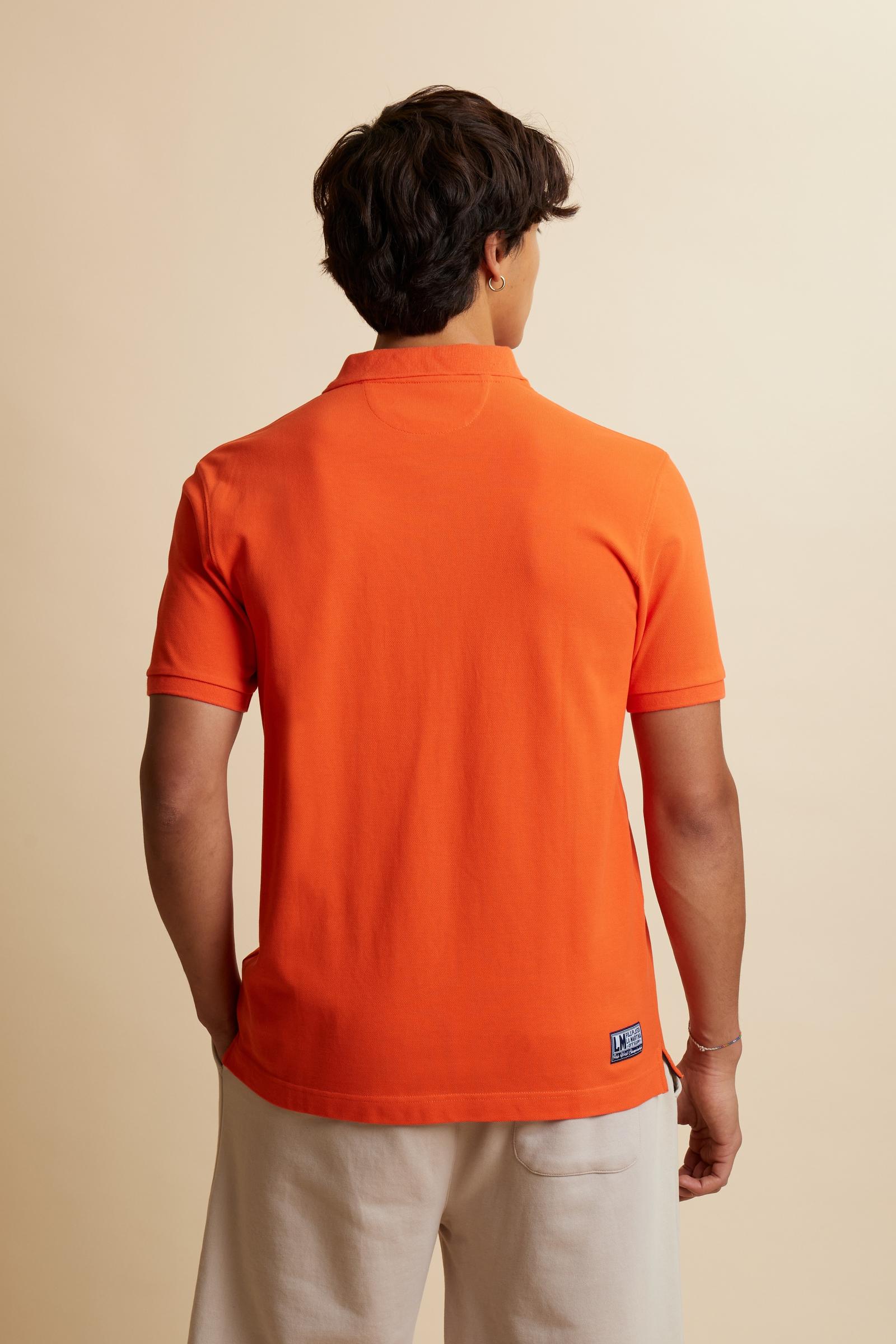 Men’s short-sleeve polo in solid 100% cotton piqué. Regular fit with matching ribbed details. Part of the “Nations” collection celebrating countries of the World Polo Tour through embroidered and printed graphics. Small contrast logo on the chest. The model wears size L. - Flame                                                                                                                                                                                                                                         