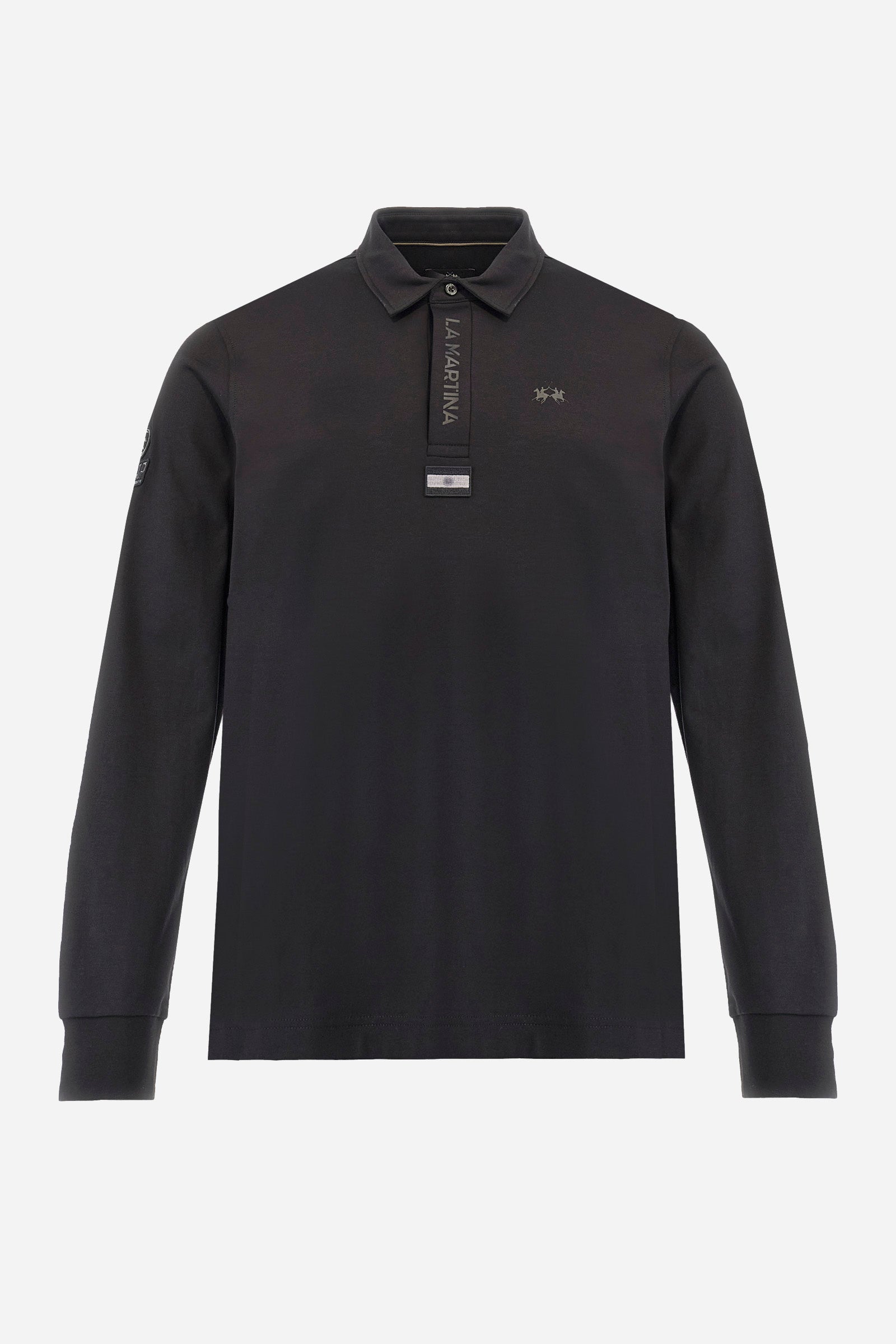 Premium men’s long-sleeve polo shirt in 100% cotton jersey with a smooth, silky texture. Hidden button placket and vertical contrast print. Patches dedicated to the Asociación Argentina de Polo (AAP) on the sleeve and below the opening. Small semi-transparent contrasting logo printed on the chest. Regular fit. The model wears size L. - Black