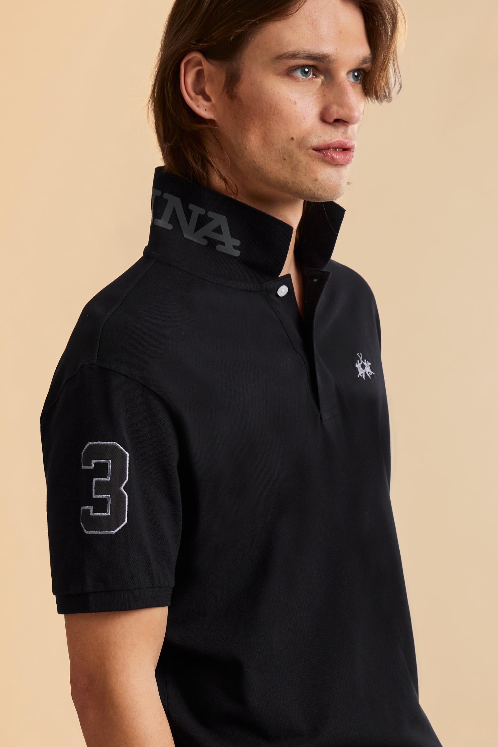 Men’s short-sleeve stretch piqué polo. Two-button placket and ribbed details, with a regular fit. Iconic style characterised by applied logo and patches. - Black                                                                                                                                                                                                                                                                                                                                                               