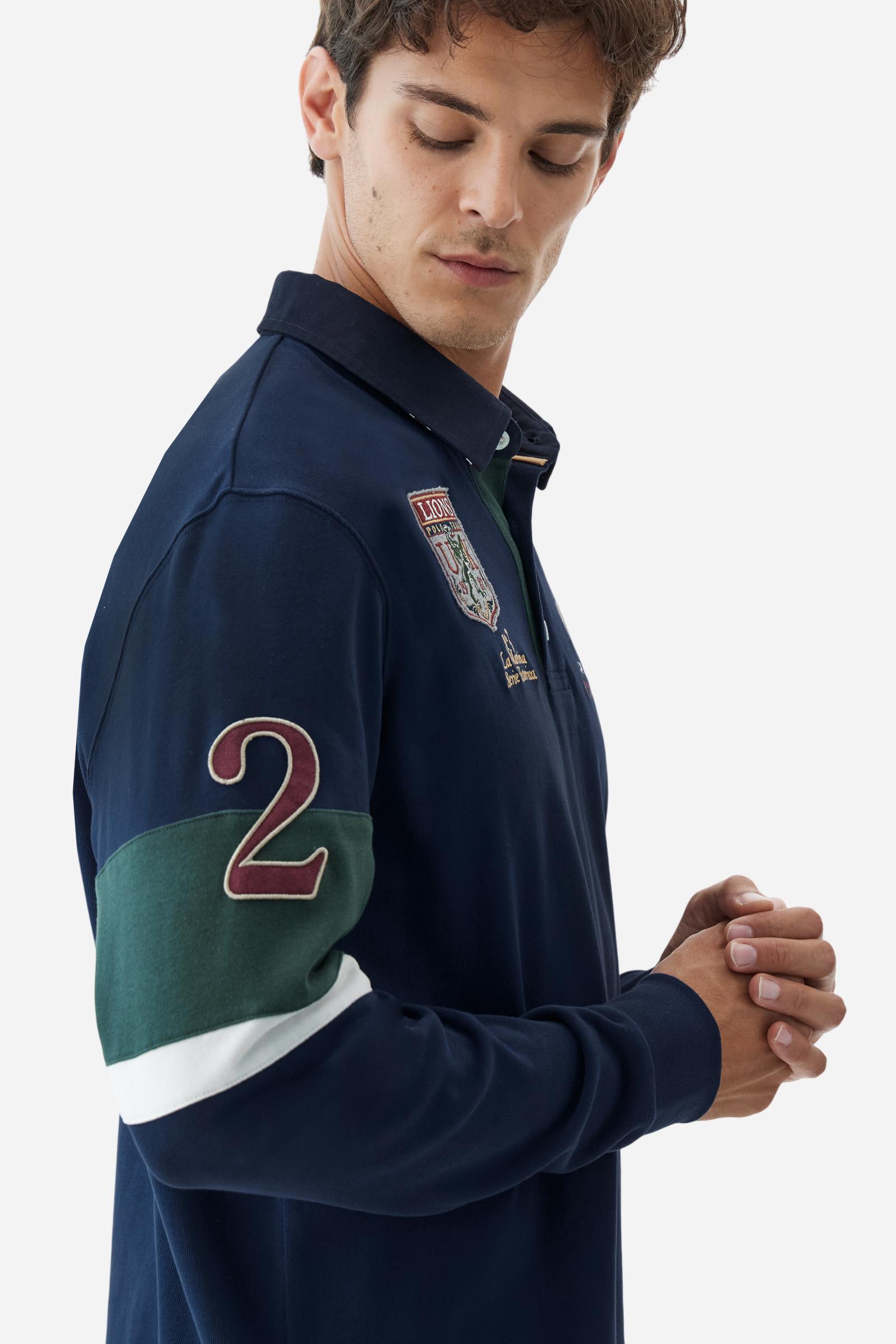 Long-sleeve polo shirt in 100% cotton jersey, soft and warm to the touch. Gabardine collar in tone with a contrast placket for a modern look. The English flag is printed under the raised right collar tip. Contrasting fabric bands and a patch with number 2 decorate the right sleeve, evoking polo player uniforms. Multicolor graphics dedicated to the English team and past special events enrich the design, with a large team logo embroidered in two-tone on the chest. Regular fit. Model wears size L. - Navy