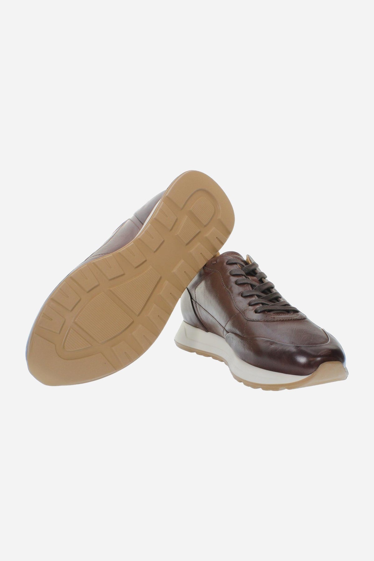 Men's sneaker crafted from soft vegetable-tanned leather with handcrafted stitching, embossed logo, two-tone rubber PU sole, and leather-colored lining. Made in Italy. - Brown