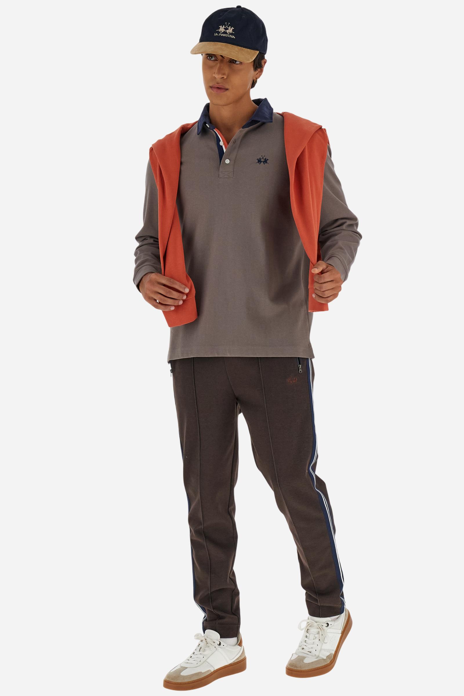 Classic men’s long-sleeve polo in soft-touch 100% cotton jersey. Contrast gabardine collar, three-button placket with multicolor striped tape. Iconic La Martina lettering printed in contrast under the collar. Small contrast logo embroidered on the chest. Regular fit for a balanced silhouette. Model wears size L. - Falcon