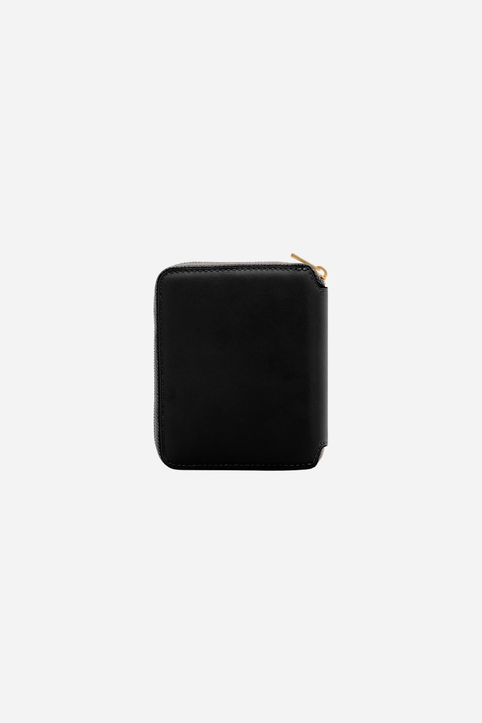 Small zip around wallet in calfskin leather. Compact and practical, with golden zip and branded metal detail. - Black
